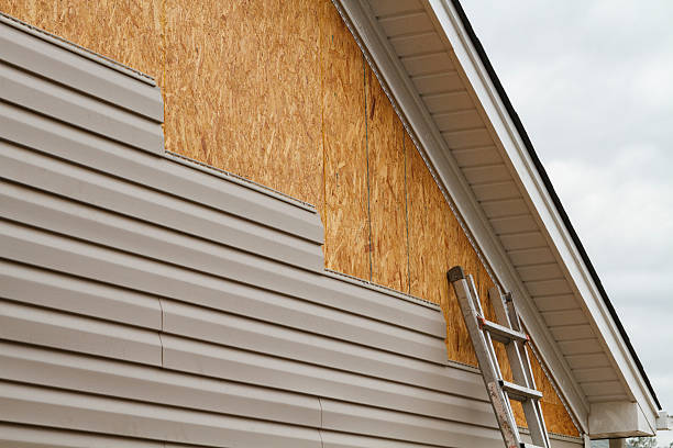 Professional Emergency Siding Repair technician working in Smithton, PA